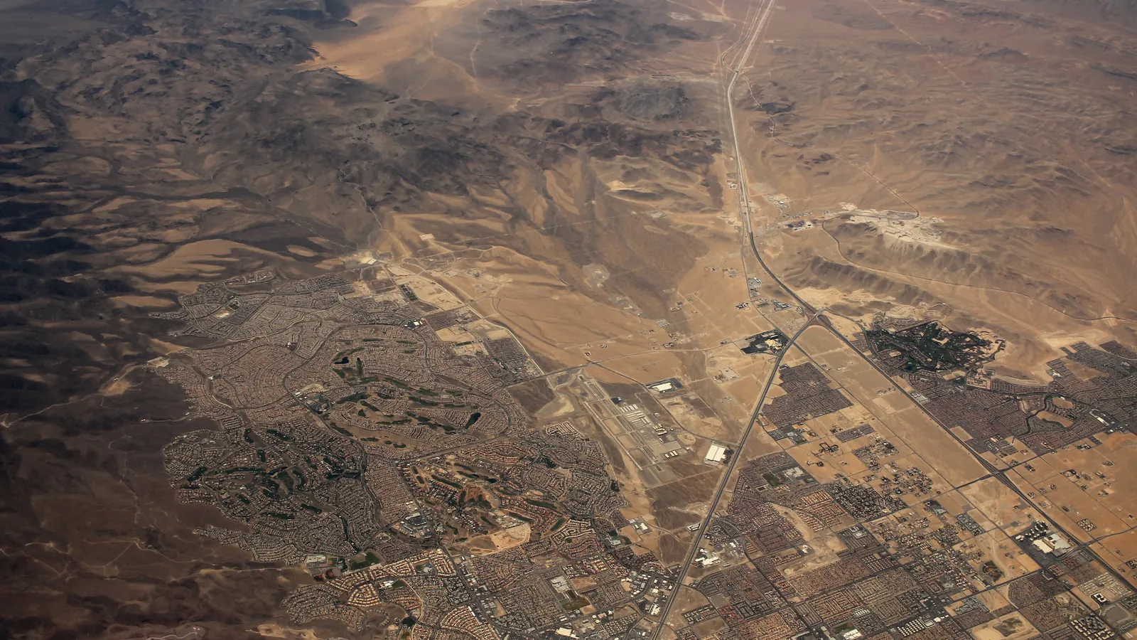 Aerial view of desert hills and a road at the southwest edge of the Las Vegas Valley