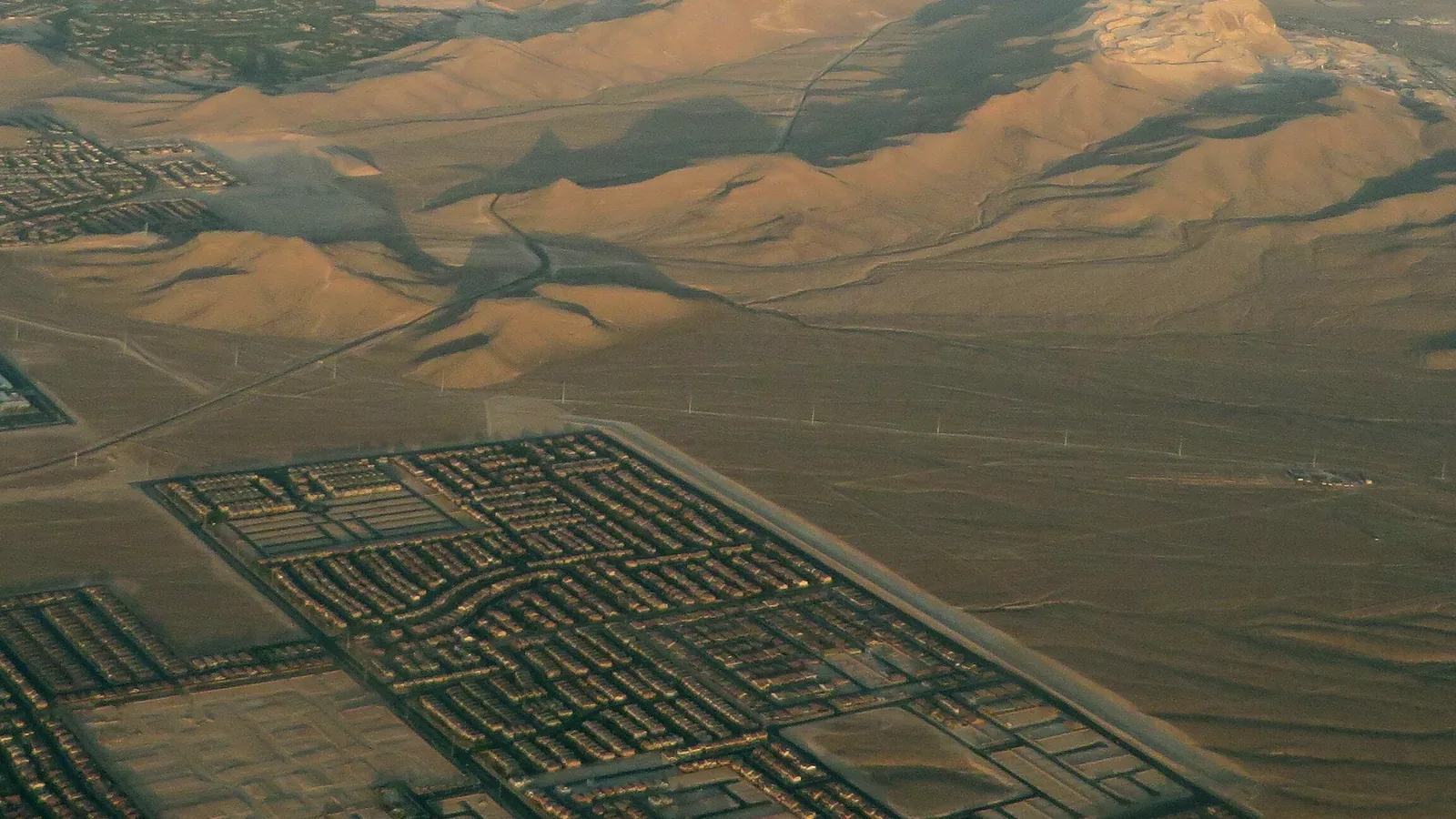 Aerial view of streets of new homes and desert hills in the Mountain's Edge area of the southwest Las Vegas Valley